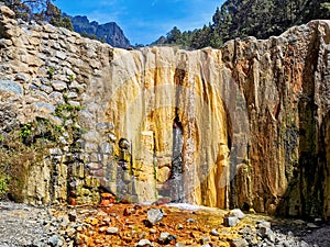 Waterfall calles `Cascada de Colores` on the island of La Palma, Canaries, Spain