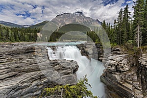 Waterfall in the Canadian Rocky Mountains- Jasper National Park photo