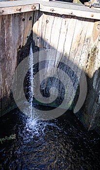 Waterfall in canal in lock