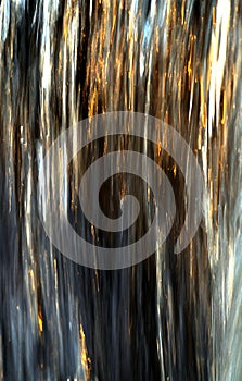 Waterfall captured with motion blur and illuminated by reflected color from sunset