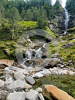 Waterfall and cascade in mountain forest, Verzasca, Switzerland