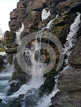 Waterfall cascading over rocks in Chessy, France