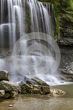 Waterfall Cascading over Sedimentary Rock