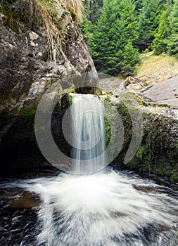 Waterfall cascading into a pool