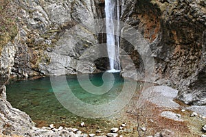 Waterfall Cascata Del Palvico with green lake photo