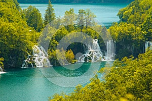 Waterfall and clear green water in the Plitvice Lakes National Park in Croatia. Beautiful world.