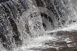 Waterfall close up with splashing and droplets