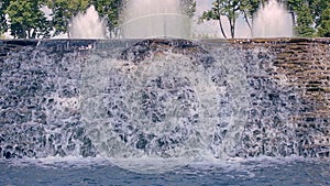 Waterfall closeup. River waterfall. Water falling down over stone cascade