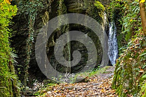 Waterfall and the creek Tiefenbach near Bernkastel-Kues on river Moselle in autumn