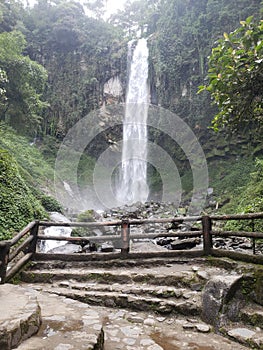 the waterfall with crocks and stairs in the morning light