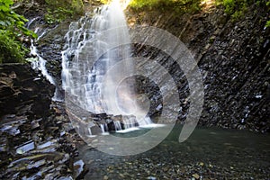 Waterfall in deep moss forest, clean adn fresh in Carpathians, Ukraine. photo