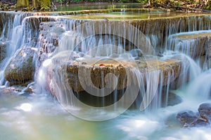 Waterfall in deep rain forest jungle