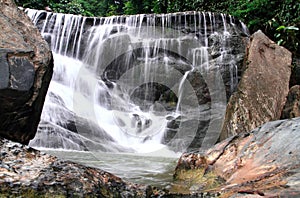 Waterfall in deep rain forest jungle.
