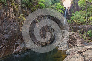 Waterfall in deep rain forest jungle Thailand