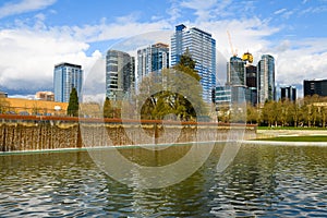 Waterfall in the Downtown Park in Bellevue and city skyline