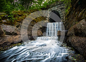 Waterfall at the end of a tunnel