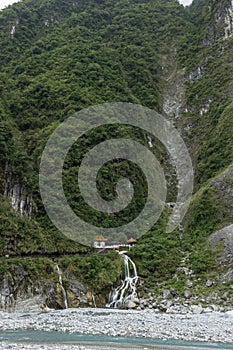 Waterfall and Eternal Spring Shrine at steep mountain at Taroko, Taiwan