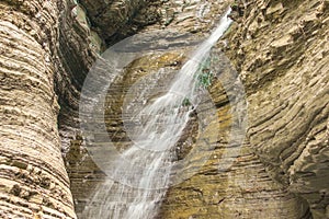waterfall flowing down the relief wall