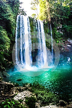 Waterfall in the forest with green water lake. Agua Azul waterfall, Mexico.