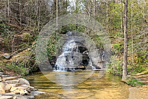 Waterfall in the forest just next to the road in Caesars head state park