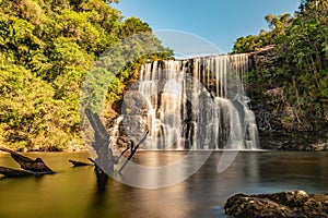 Waterfall with forest, rocks and vegetation