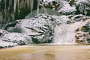 waterfall in the forest on Rufabgo creek in Adygea on a frosty winter morning.