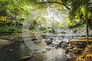 The Waterfall in the forest and sunrise in the morning