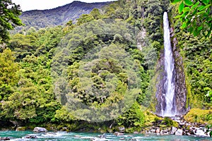 Waterfall in the forest in Westland National Park, New Zealand