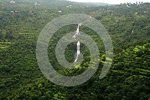 Waterfall on forested mountain