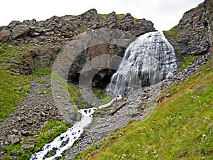 Waterfall Girlish Braids Between The Mountains Of Northern Caucas photo