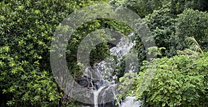 Waterfall and Green Forest in Rainy Season