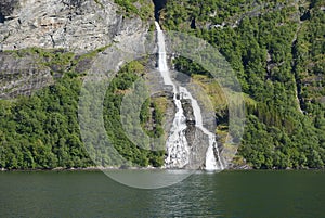 Waterfall from the green hill in Norway