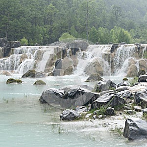 Waterfall group landscape in rain