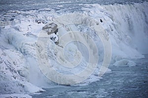 Waterfall of Gullfoss in Iceland, Europe surrounded by ice and snow