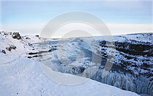 Waterfall of Gullfoss in Iceland, Europe surrounded by ice and snow