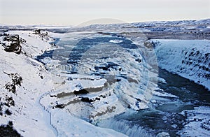 Waterfall of Gullfoss in Iceland, Europe surrounded by ice and snow