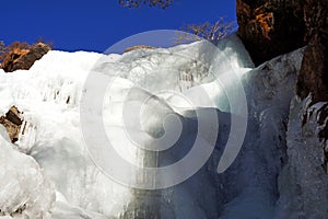 The waterfall has become completely ice under deep blue sky at Darjeeling in India