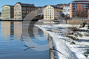 Waterfall in the historic industrial landscape at Drags in Norrkoping, Sweden photo