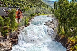 Waterfall and house in Lom, Norway