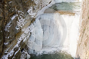 Waterfall in icy river