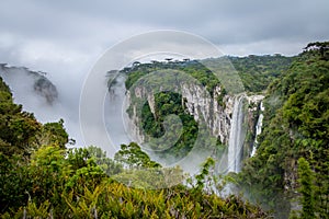 Waterfall of Itaimbezinho Canyon with fog at Aparados da Serra National Park - Cambara do Sul, Rio Grande do Sul, Brazil