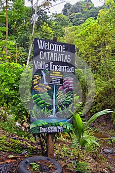 Waterfall Jaco Costa Rica, Trail views, Catarastas Valle Encantado - Hidden waterfall surrounded by green trees in the jungle. photo