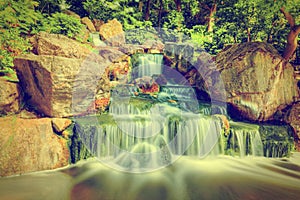 Waterfall in Japanese garden. Holland Park in London, UK. photo