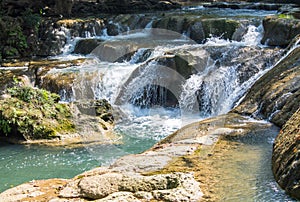 Waterfall in the jungle on the rocks