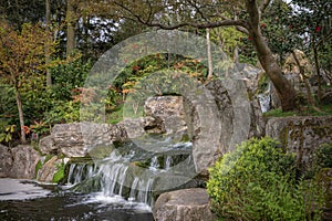 Waterfall in Kyoto Garden, a Japanese garden in Holland Park, London, UK photo