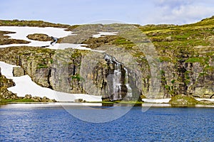 Waterfall and lake Flotvatnet, Aurlandsfjellet Norway