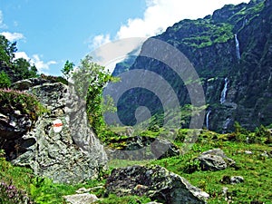 Waterfall Lammerbachfall or Wasserfall LammerbachfÃÂ¤lle, Lammerbach stream in the Alpine Valley of Maderanertal photo