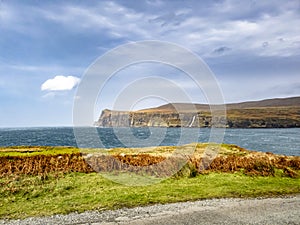 Waterfall on the left stopped and reversed by autumn storm Callum on the cliffs seen from Lower Milovaig - Isle of Skye