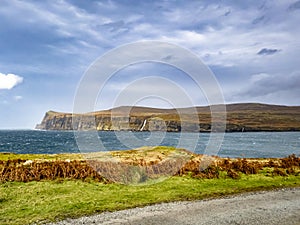 Waterfall on the left stopped and reversed by autumn storm Callum on the cliffs seen from Lower Milovaig - Isle of Skye