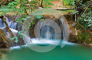 Waterfall with long exposure for an effect spun in the middle of the green nature